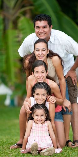 A picture of a husband and wife with their 3 children. Family is a great reason to Leave a Legacy through Life Insurance