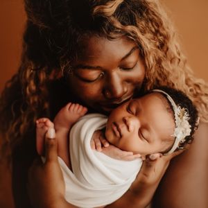 Picture of a mother and her newborn child. Additions to the family are another reason to review your life insurance needs.