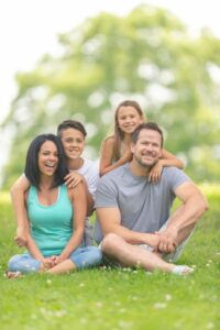 Couple with two kids, boy and girl. Choosing the right term life insurance policy for the family.