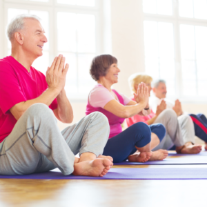 Alternative treatment: Yoga. Elders doing yoga as their alternative treatment