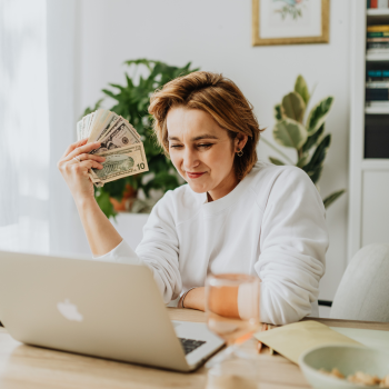 A women Enjoying the cash from her policy. How to borrow money from your life insurance?