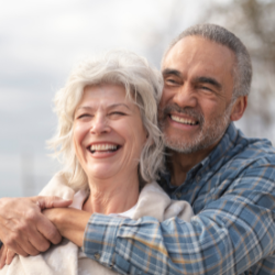 Senior couple hugging and smiling together