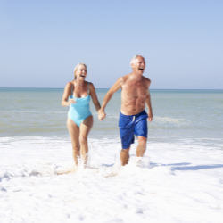 Couple enjoying retirement on the beach.